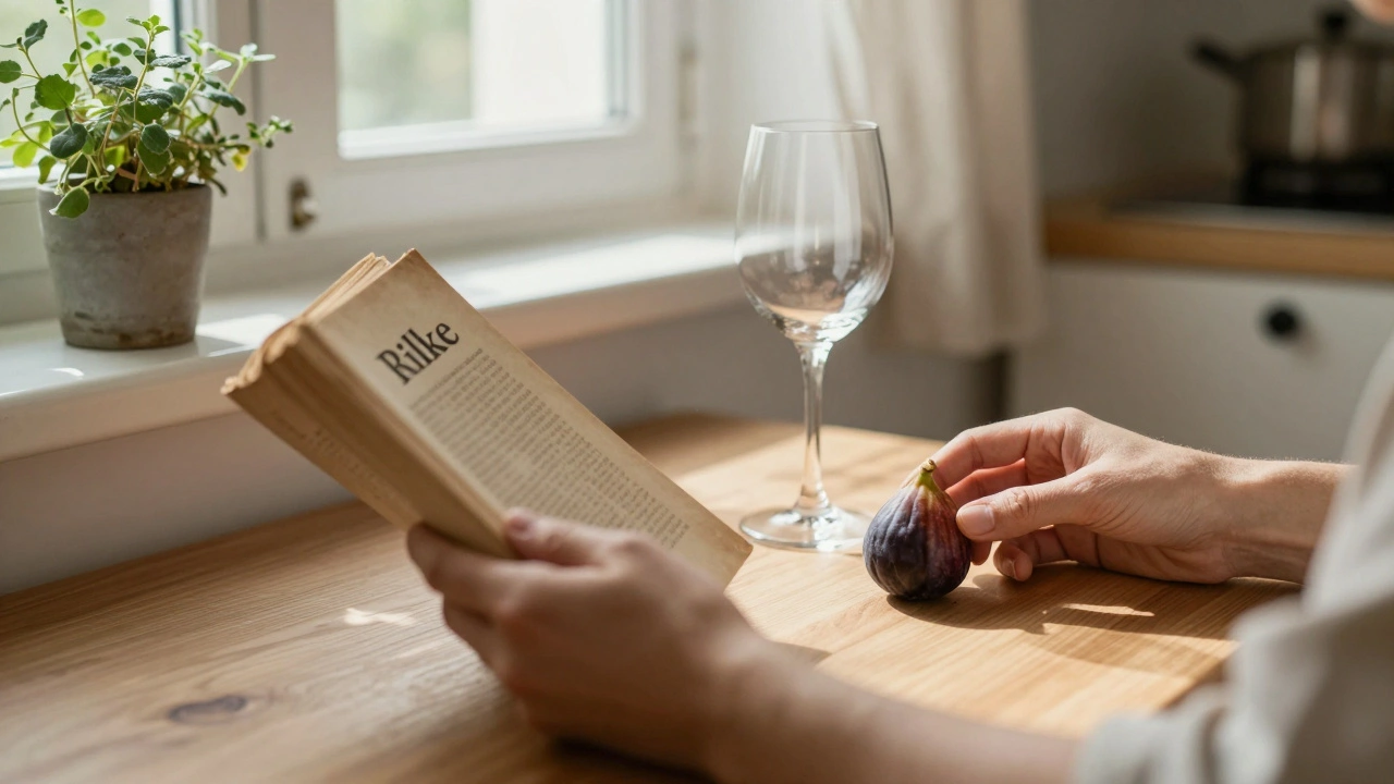 Hands placing a fig on a wooden table beside a wine glass and open book, in a sunlit Parisian kitchen with herbs on the windowsill.
