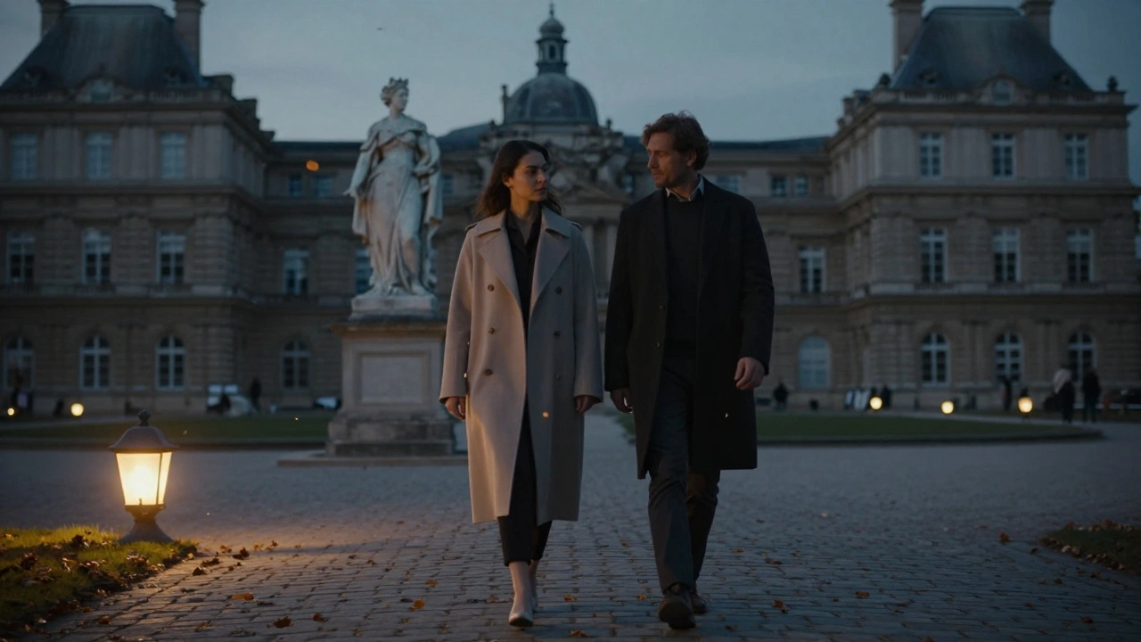 Two figures walk peacefully through Luxembourg Gardens at twilight, surrounded by soft lantern light and falling leaves.